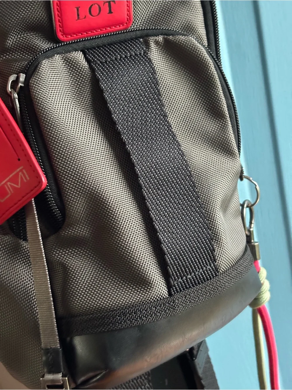 Tumi FIFE Gray SLIM Sling Bag dark grey and black.